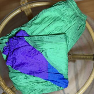 Pantalón deportivo vintage 90s · Colorblock verde, morado y azul